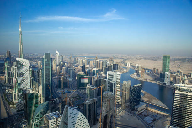 Aerial view of modern skyscrapers and the extensive canal system in Dubai, showcasing urban real estate options.