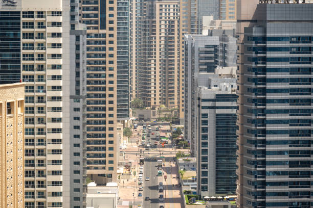 Aerial view of modern high-rise buildings and busy streets in Dubai, showcasing the popularity of urban housing.