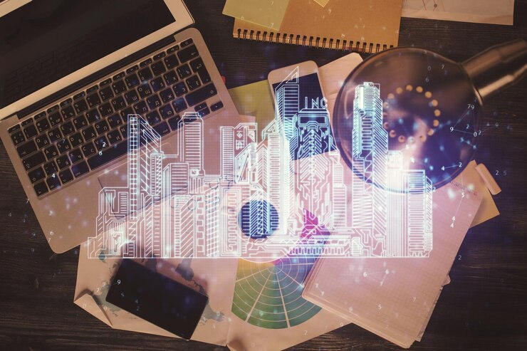 A laptop and paperwork on a desk with a digital overlay of a cityscape hologram.